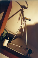 high-tech camera mount...wait a minute, is that a tripod or an easel? Do I see duct tape?